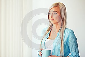 Young woman near window