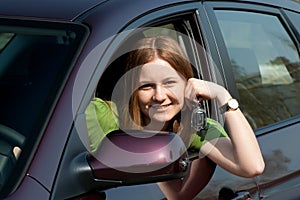 The young woman with the new car