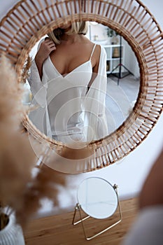 young woman in nightie pajamas at home.