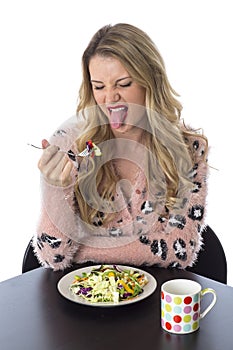 Young Woman Not Enjoying Eating Mixed Vegetables