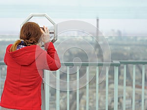 Young woman on observation deck in Paris, France