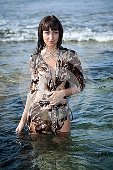 Young woman in the ocean water