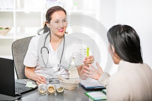 Young woman in an office at the doctor homeopaths.