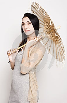 Young woman with an old Chinese umbrella