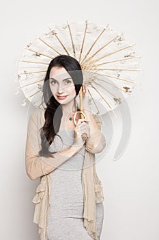 Young woman with an old Chinese umbrella