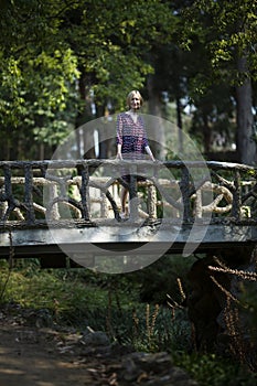 A young woman in an old Park. Porto, Portugal.