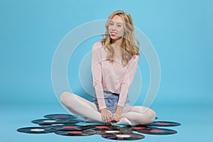 Young woman with old vinyl record