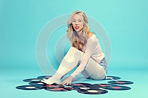 Young woman with old vinyl record