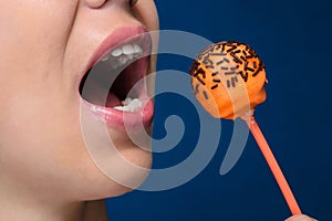 Young woman with orange cakepops