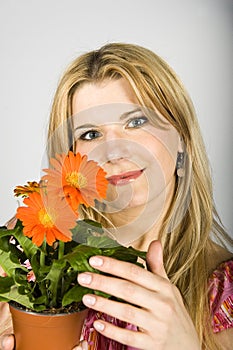 Young woman with orange flowers