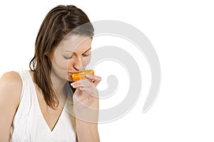 Young woman with orange slice