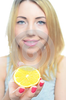 Young woman with orange slice