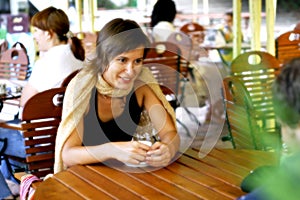 Young woman at outdoor coffee shop