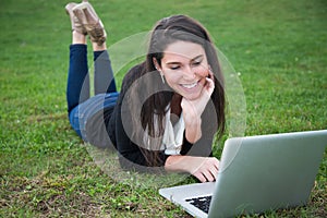 Young woman outdoors with computer