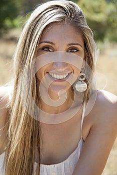 Young woman outdoors portrait. Soft sunny colors.