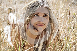 Young woman outdoors portrait. Soft sunny colors.