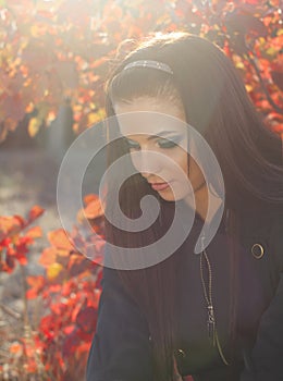 Young woman outdoors portrait. Soft sunny colors