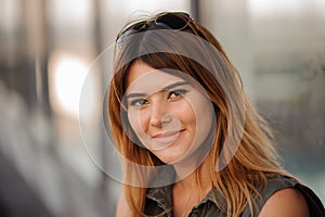 Young woman outdoors portrait. Soft sunny colors.