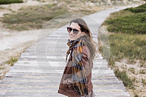 Young woman outdoors portrait on a windy day photo