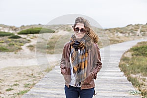 Young woman outdoors portrait on a windy day photo