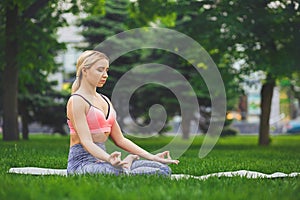 Young woman outdoors, relax meditation pose