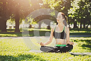 Young woman outdoors, relax meditation pose