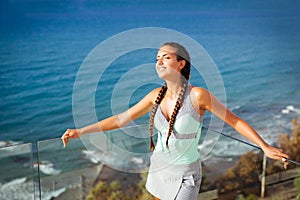 Young woman overlooking Mediterranean Sea