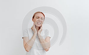 Young woman with pain in head. Sore throat,toothache. Headache migraine. White background
