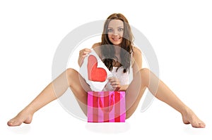 young woman with painted heart and gift bags