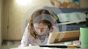 Young woman painting artist at home sitting on the floor creative painting