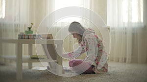 Young woman painting artist at home sitting on the floor creative painting