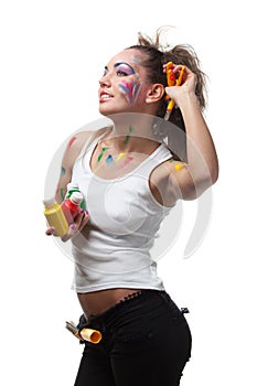 Young woman with paints and paintbrushes.