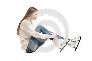 Young woman in pair of ice skates isolated