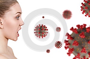 Young woman in panic looks on coronavirus cells.