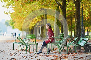 Young woman in Paris by fall