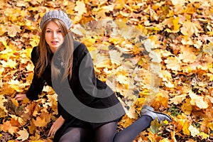 Young woman in the park autumn vibrant colors