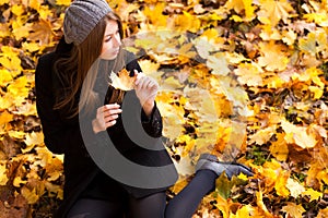 Young woman in the park autumn vibrant colors