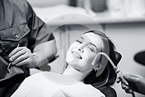 Young woman patient waiting treatment in stomatology clinic.