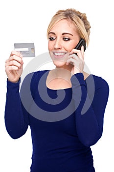 Young Woman Paying by Credit Card and Cell Phone