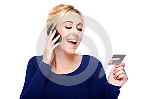 Young Woman Paying by Credit Card and Cell Phone