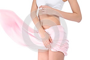 Young woman with perfect smooth skin and soft fabric on white, closeup of belly. Beauty and body care