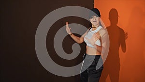 Young woman performs hip hop dance in a modern and energetic performance