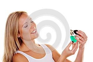 Young woman with perfume bottle