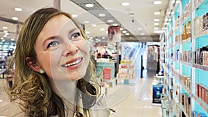 Young woman in the perfumery