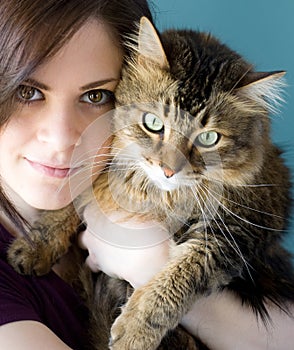 Young woman with pet cat