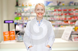 Young woman pharmacist drugstore or pharmacy photo