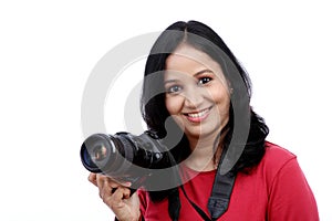 Young woman photographer with camera