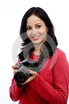 Young woman photographer with camera