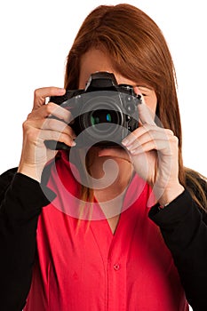 Young woman photographer with camera in her hand