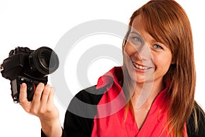 Young woman photographer with camera in her hand